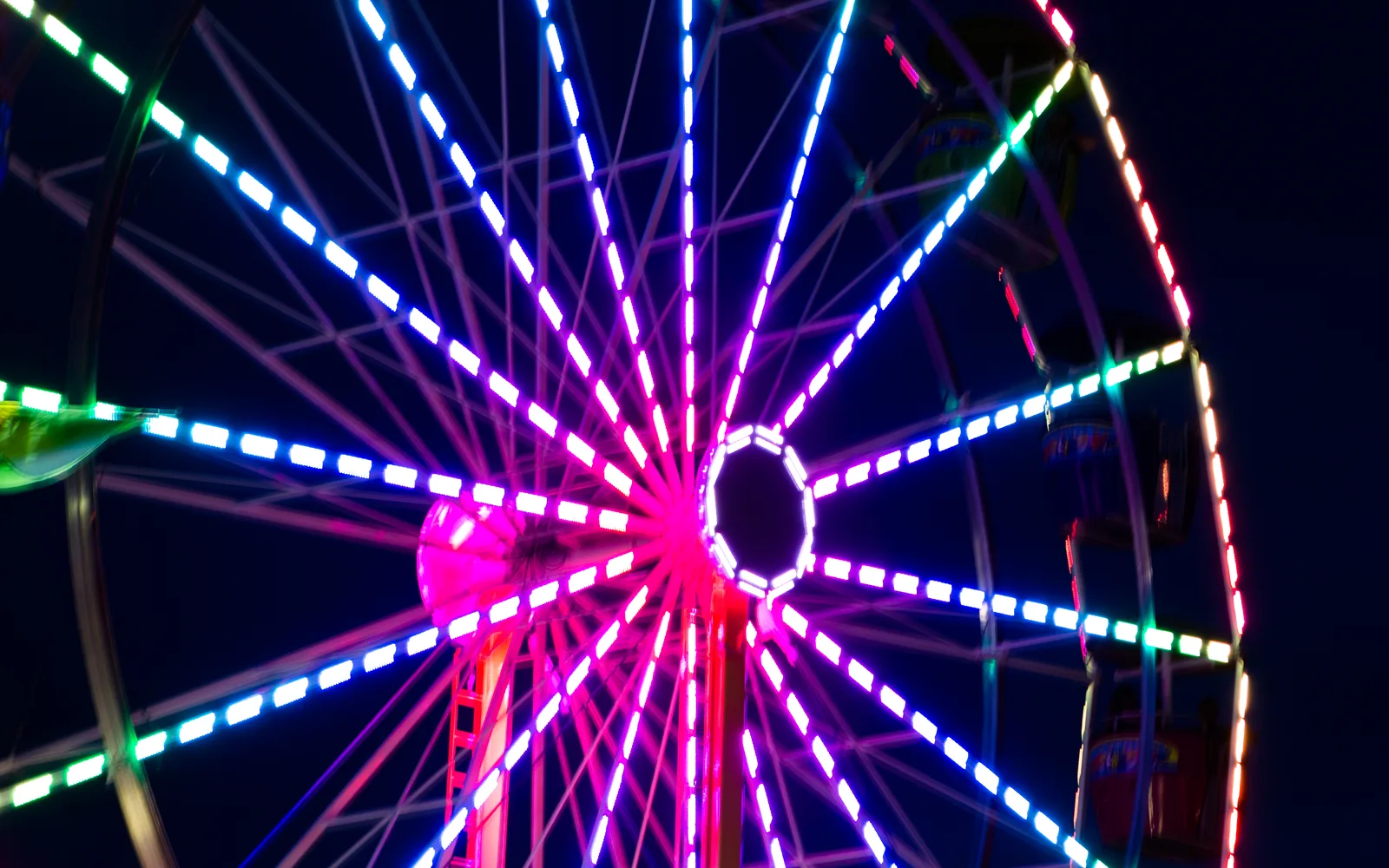Illuminated ferris wheel at a California county fair at night